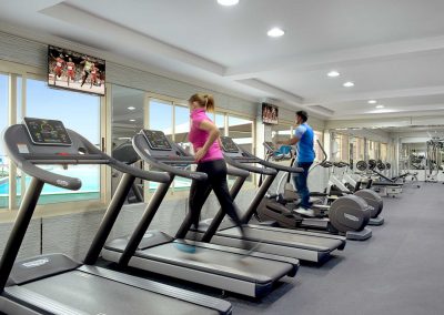 Lifestyle Photographer - Couple Working Out At A Luxury Gym